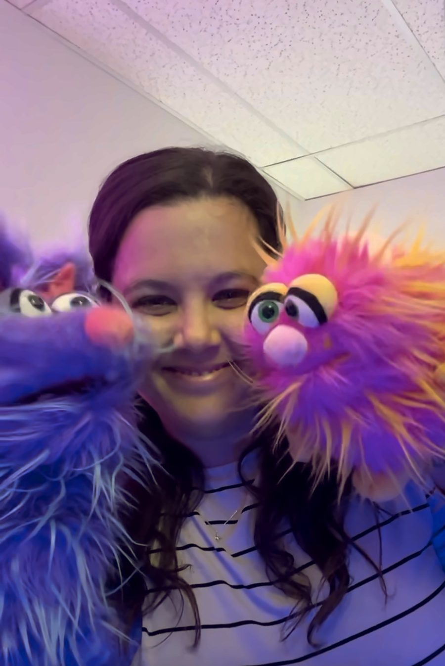 Dr. Taylor with two puppets
